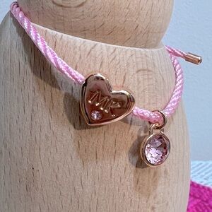 NWOT Mary Kay bracelet with pink cord and Swarovski elements charms